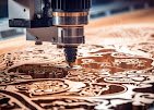 CNC router machine carving detailed wooden panel